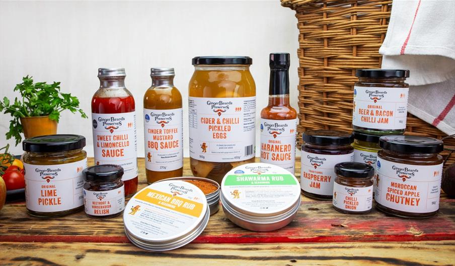 Shot of jars of eggs, spreads, chutneys, and bottles of sauces