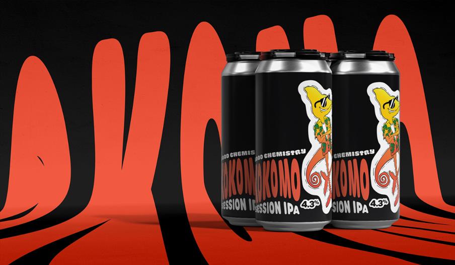 Three cans of IPA with black and red graphics in the background