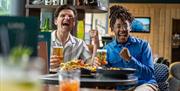 Men laughing with drinks