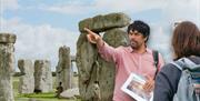 Photo of Jules and a tour group in front of Stone Henge
