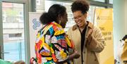 Two people talking and laughing