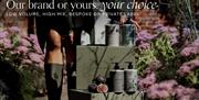 A person standing beside a stack of boxes and Natural Spa Factory products, with a text overlay reading "Our brand or yours, your choice".