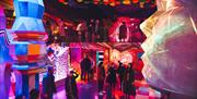 Wake the tiger group exploring colourful room